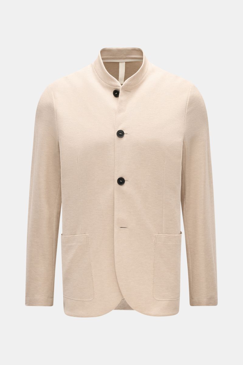 Front view of Harris Wharf London Knit blazer beige made from pure cotton piqué with a slim fit, four-button style, open edge finish, patch hip pockets, two inside pockets, slim standing collar, and unlined design.