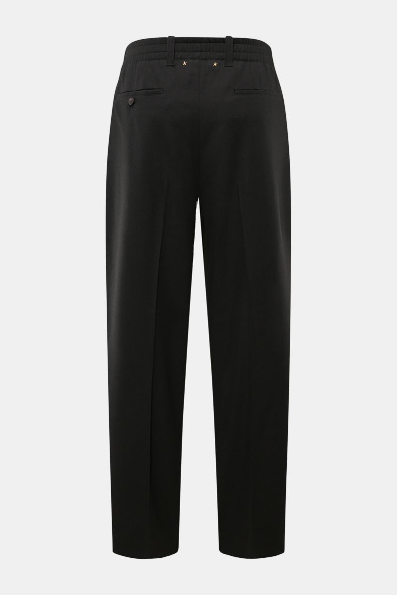 Golden Goose Wool trousers black shown from the back, ankle-length tapered fit in pure virgin wool twill with double pleat, French and hip pockets, partially elasticated waistband, zip and button closure, and rivet detail at the waist. Timeless elegance i