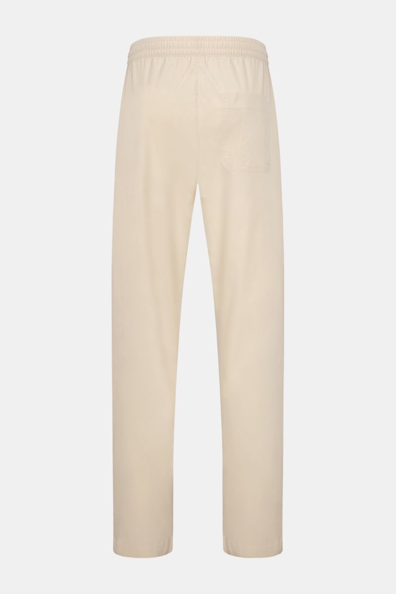 Rückansicht von 04651/ A trip in a bag Hosen in Beige mit Gummibund und Gesäßtasche, frontal in voller Länge fotografiert.