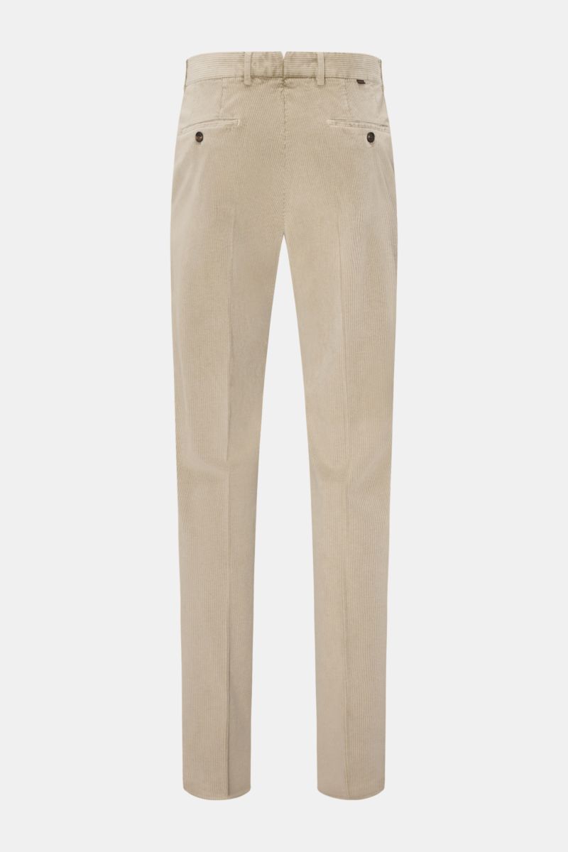 Rear view of Incotex Cordhose beige tapered fit corduroy pants made of cotton and microfiber, soft touch, garment dyed, with zipper, button, French pockets, small watch pocket, buttoned back pockets, and small web label on waistband.