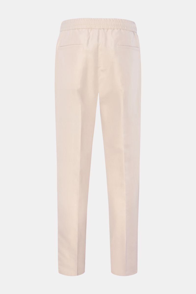 Brunello Cucinelli Jogpants 'Leisure Fit' sand, Rückansicht, schmal zulaufend, hoher Bund, kurzer Schnitt, twill aus Leinen und Baumwolle, Tunnelzug, Taschen.