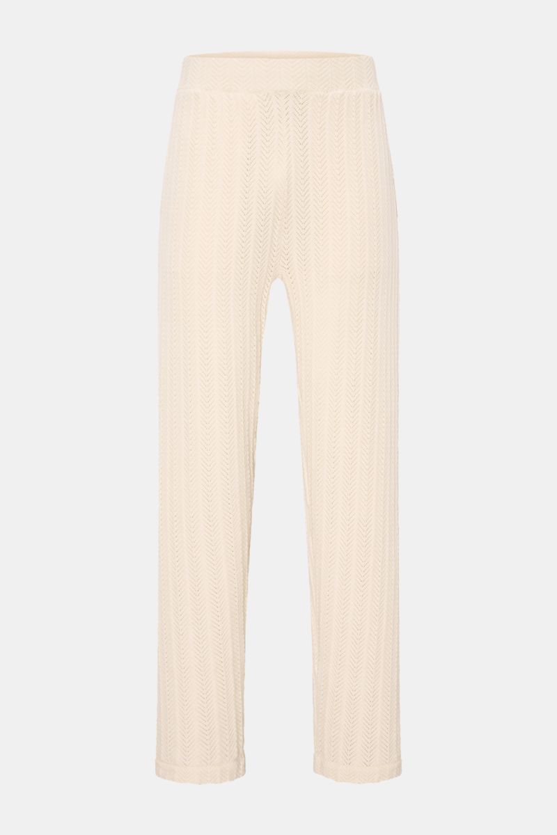Soft Goat Knit jogger pants cream shown from the front, featuring a cotton and cashmere blend with a textured zigzag knit, semi chunky, regular fit, and elastic wide waistband with concealed hip pockets; sustainably produced and certified.