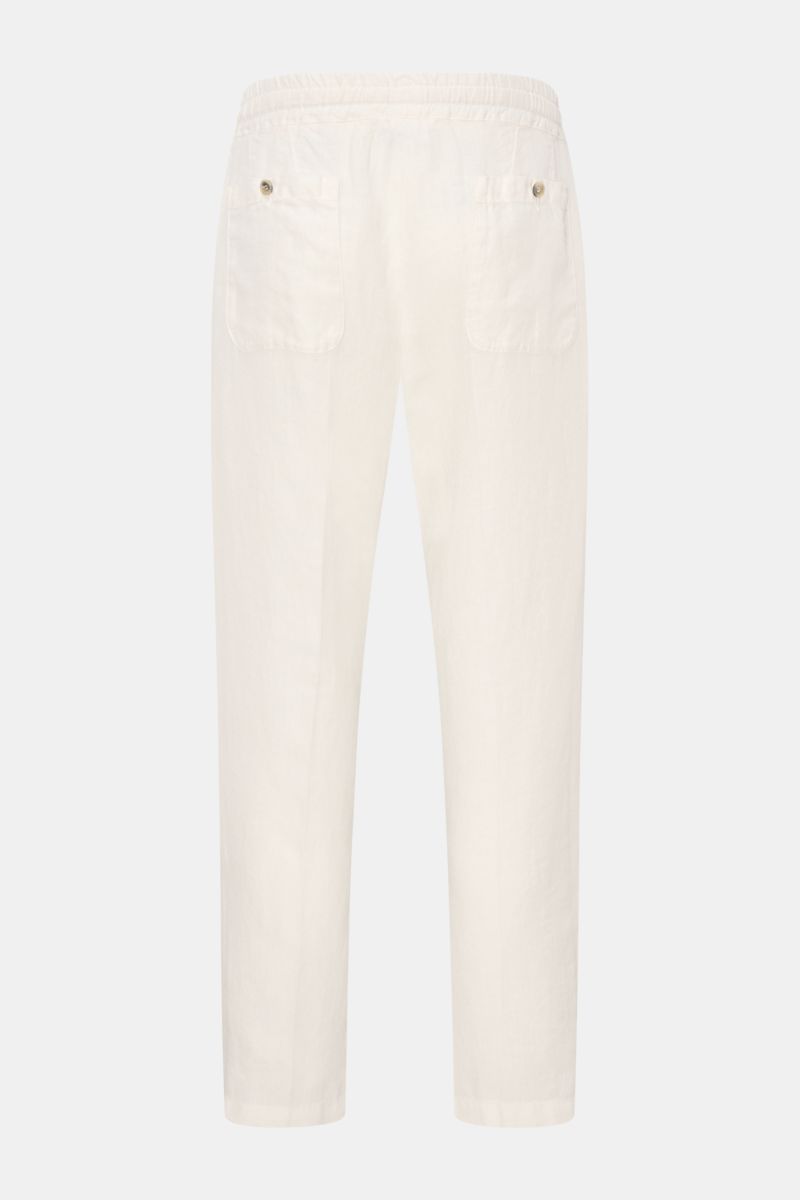 Rear view of Altea Linen jogger pants 'Mattia' off-white in pure linen with elasticated waistband, back button pockets, tapered ankle length fit.

Description: Casual luxury for warm days: The jogger pants 'Mattia' in pure linen by ALTEA are the perfec