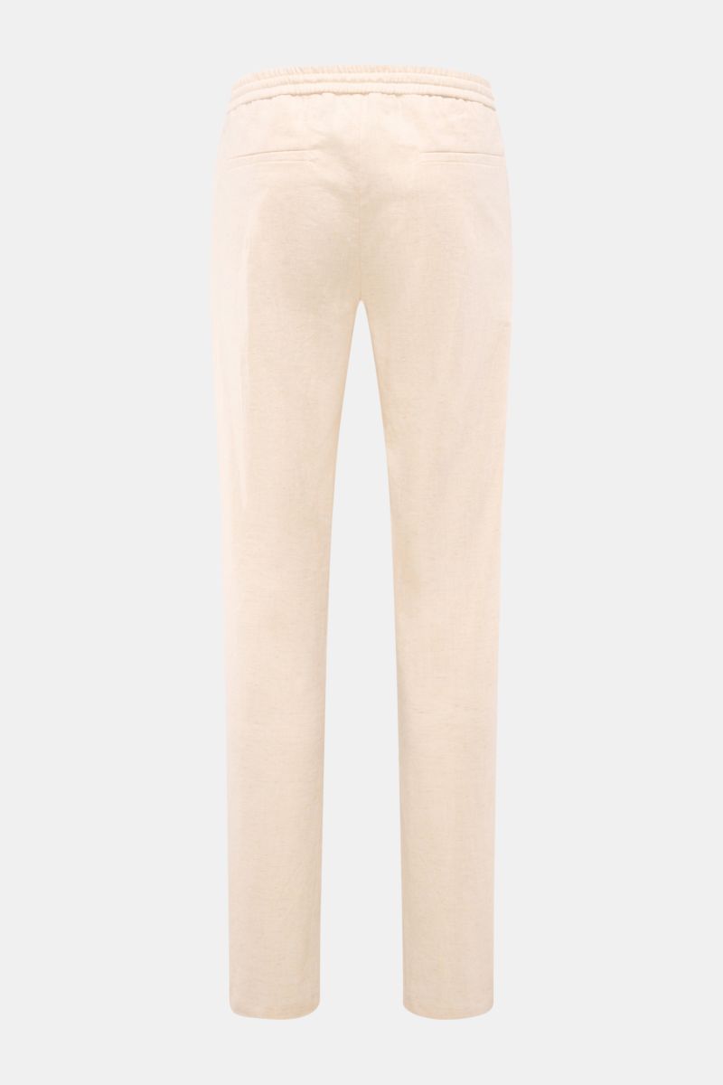 Rear view of Aurélien Leinen-Jogpants creme meliert, pure linen, lightweight texture, regular fit with narrow taper, elastic waistband with drawstring, zipper and button closure, French pockets, single pleat, and piped back pockets, offering luxurious cas