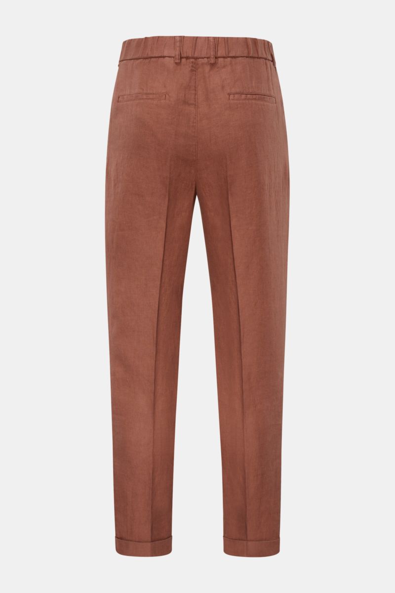Rear view of 04651/ A trip in a bag Linen jogger pants 'Linen Pants' rust brown in pure linen, regular fit, tapered and short cut, with elasticated waistband, drawstring, zip and button, featuring French and jetted back pockets, and signature material tex