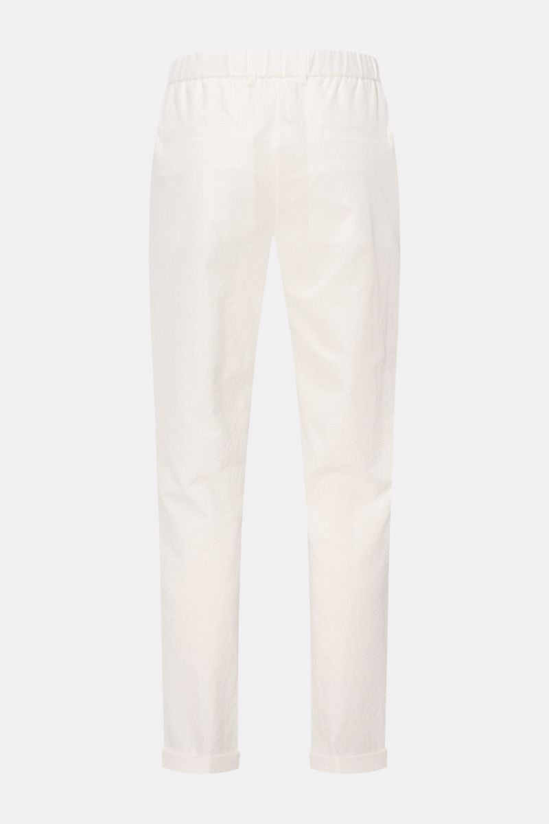 Rear view of 04651/ A trip in a bag Seersucker trousers 'Technical Seersucker' off-white, made of microfibre seersucker with fine typical texture, robust fabric, tapered fit, regular thigh width, ankle length, zip and waist button, double pleat, French po