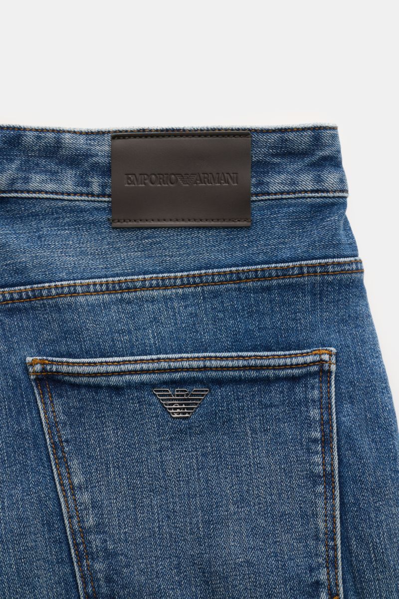 Close-up rear view of Emporio Armani Jeans blue showing denim texture, leather patch, and metal logo on back pocket.

Comfort meets style: These jeans by EMPORIO ARMANI have a comfortable feel and a timeless aesthetic for modern casual looks.


