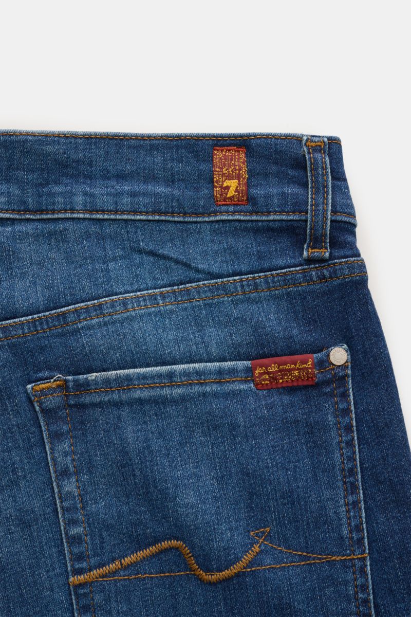 Close-up rear view of 7 for all mankind Jeans 'Slimmy' dark blue showing back pocket with stitching, small woven label on waistband.

Seven pairs of jeans should be enough to get you through life – that’s the philosophy of denim label 7 FOR ALL MANKIND