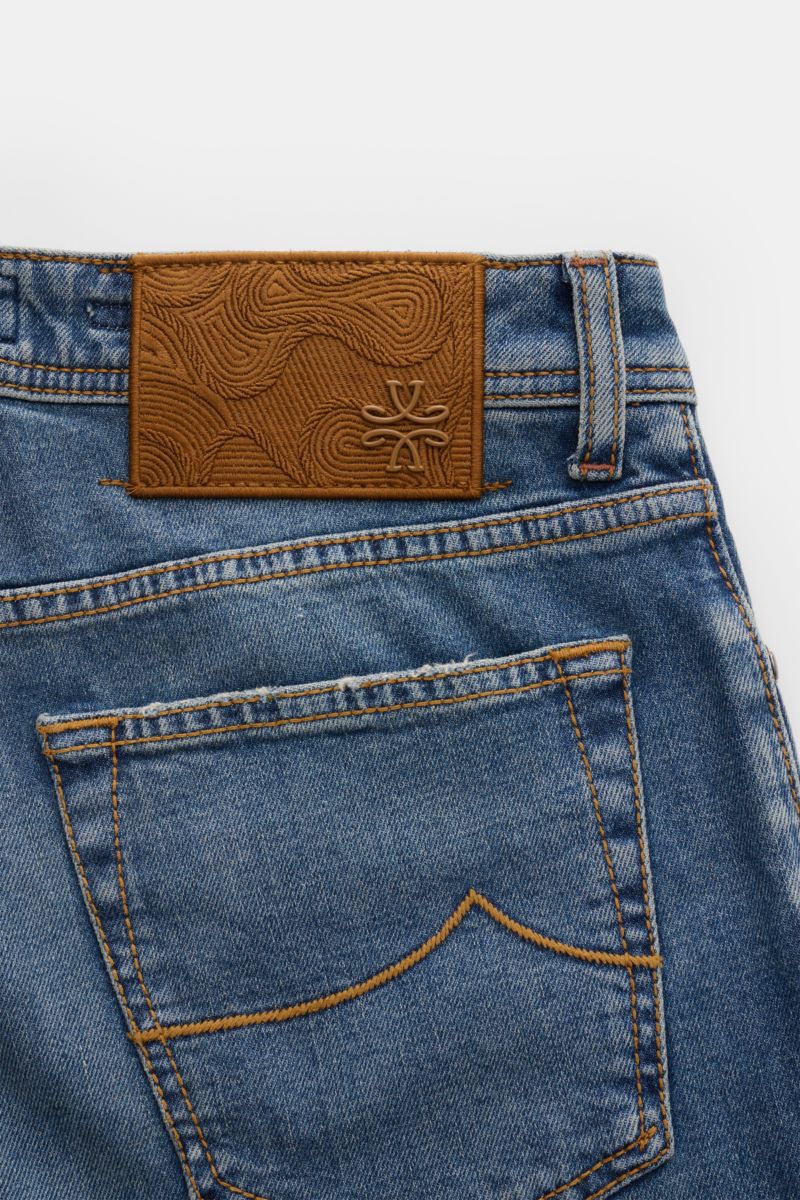 Close-up rear view of Jacob Cohen Jeans 'Bard' smoky blue showing back pocket, stitching details, and embossed leather patch on slightly stretchy, subtly used denim.