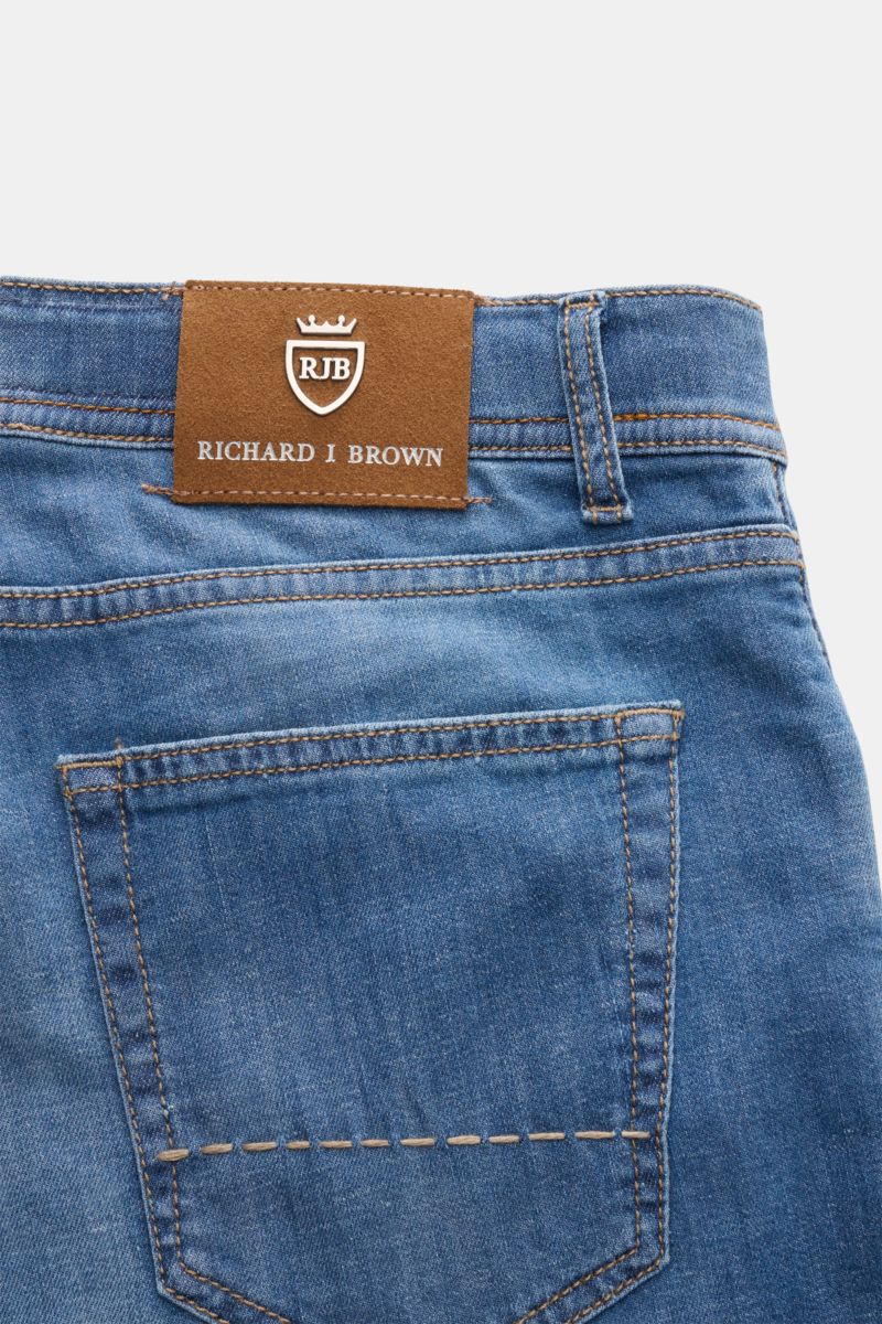 Close-up rear view of Richard J. Brown Jeans 'Tokyo' smoky blue showing back pocket, leather patch with logo, and denim texture. Timeless skill in denim workmanship: The jeans 'Tokyo' by RICHARD J. BROWN combine premium comfort with a precise finish – a v