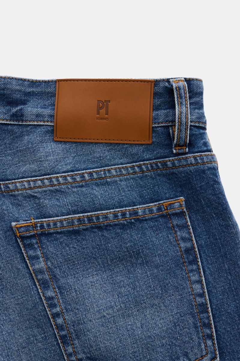 Close-up rear view of PT Torino Denim Jeans 'Rebel Fit' smoky blue showing authentic denim, subtle used finish, leather patch, and detailed stitching.