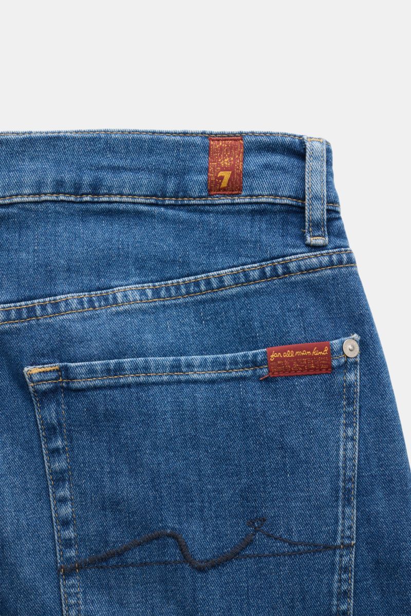 7 for all mankind Jeans 'The Straight' blue shown from the back close-up, featuring subtle used wash, high waist, and tonal stitching.