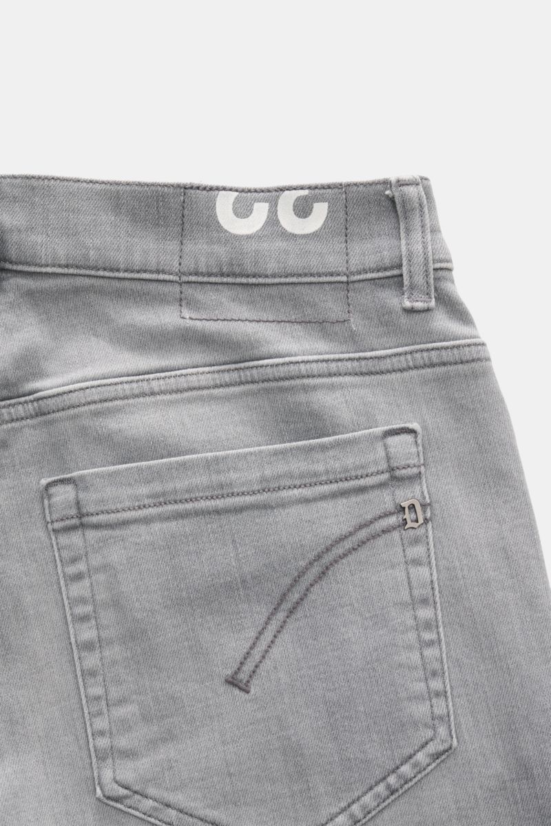 Close-up back view of Dondup Jeans 'George' grey showing soft stretchy cotton denim with authentic used wash, skinny fit, slim calf, low waist, button fly, five-pocket style, jetted coin pocket, back pockets with stitching, signature metal initial, and wo