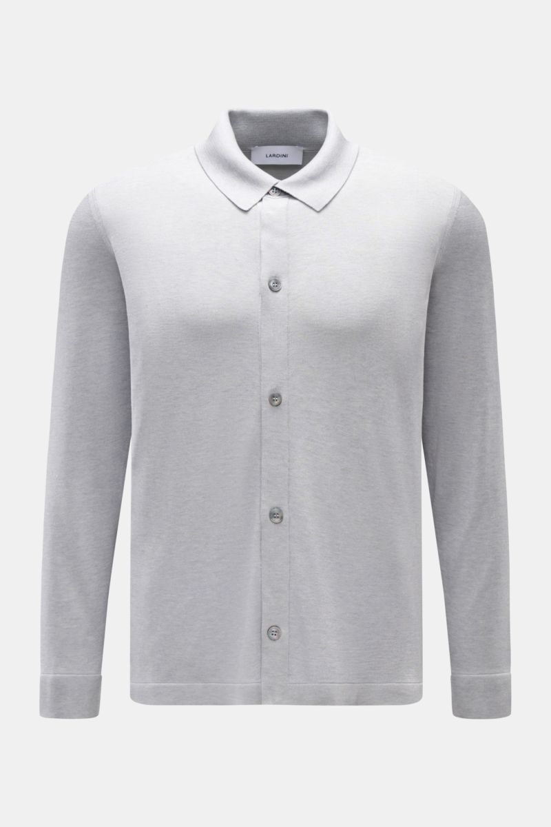 Front view of Lardini Silk knit shirt smoky blue/light grey mottled with slim fit, turn-down collar, button placket, and double-layered hems.

Effortless style: This knit shirt by LARDINI combines a fine knit in pure silk with exceptional comfort. Airy
