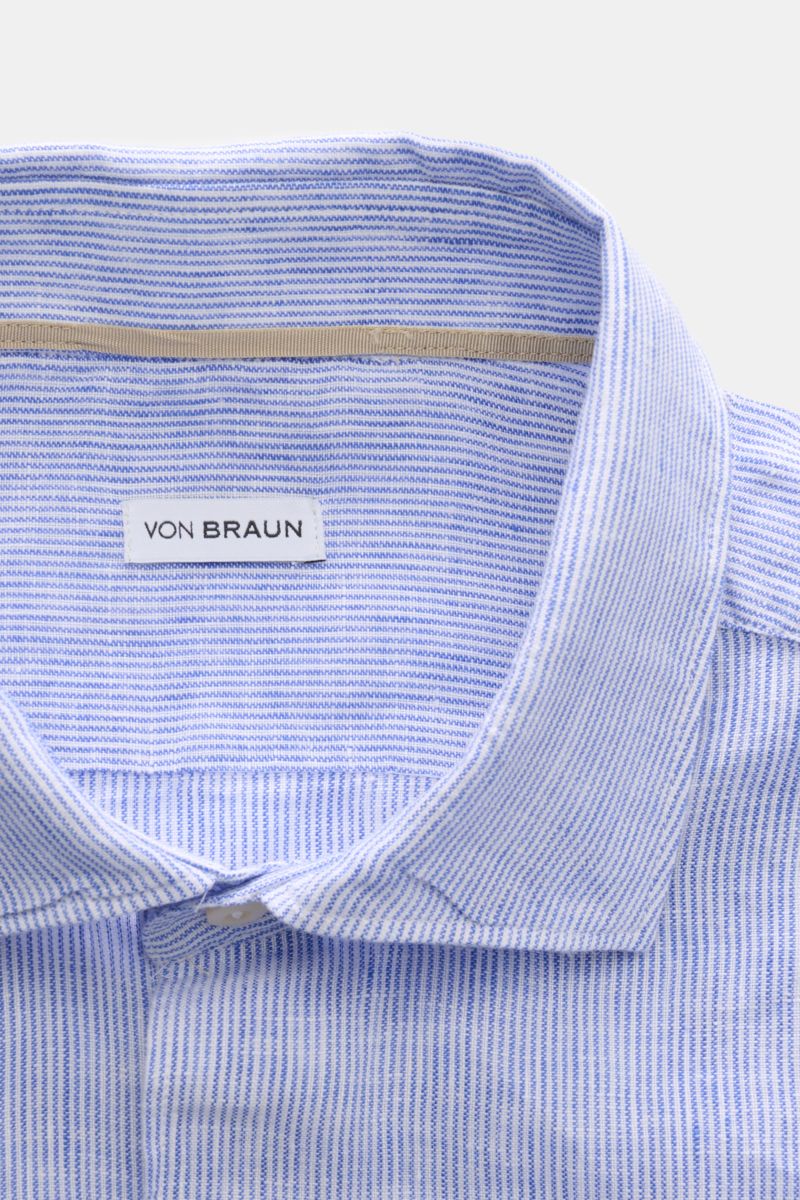 von Braun Linen shirt shark collar blue/white striped shown from above, highlighting pure linen fabric, fine stripes, shark collar, and label. Effortlessly lightweight: This VON BRAUN shirt in pure linen has an airy feel and a relaxed look – a stylish com