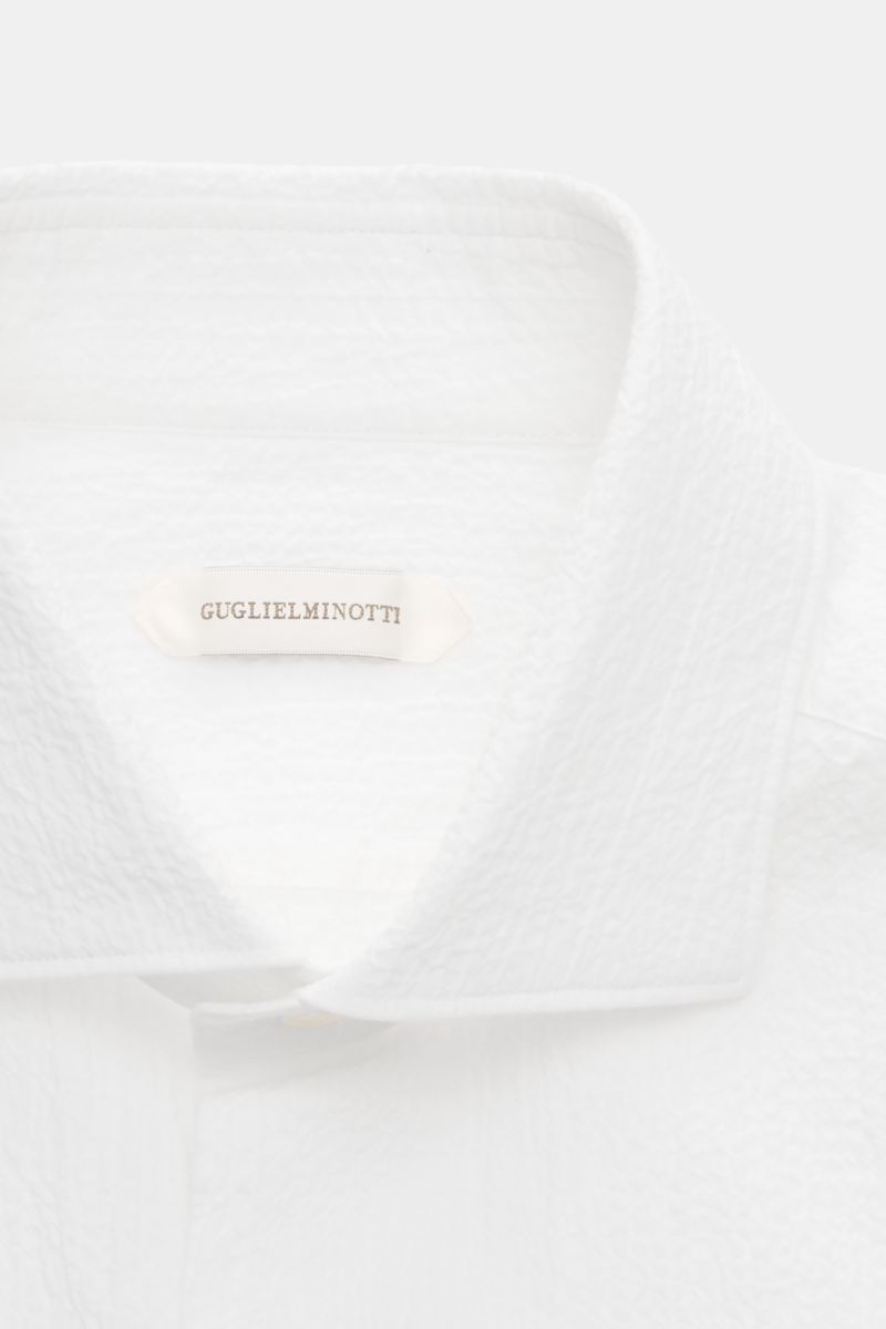 Close-up of the Guglielminotti Casual shirt shark collar white, showing the textured crinkle effect fabric and slim shark collar from a front top perspective.

Description:
An elegant casual shirt with a twist: this slim model GUGLIELMINOTTI is made of