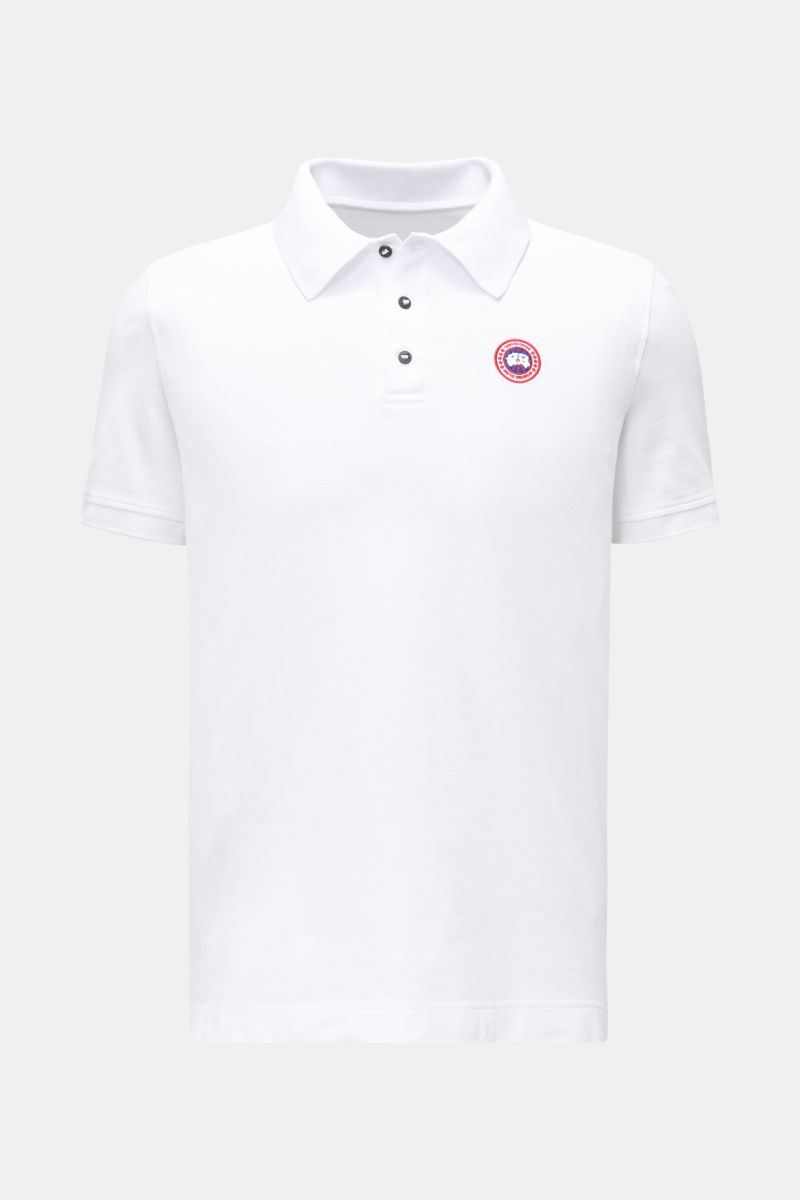 Front view of Canada Goose Poloshirt 'Beckley' weiß, a white short-sleeve polo made from pure cotton piqué with a three-button placket and Canada Goose patch.

Das klassische Poloshirt 'Beckley' ist ein Must-have in der sportiven Herrengarderobe: Aus B