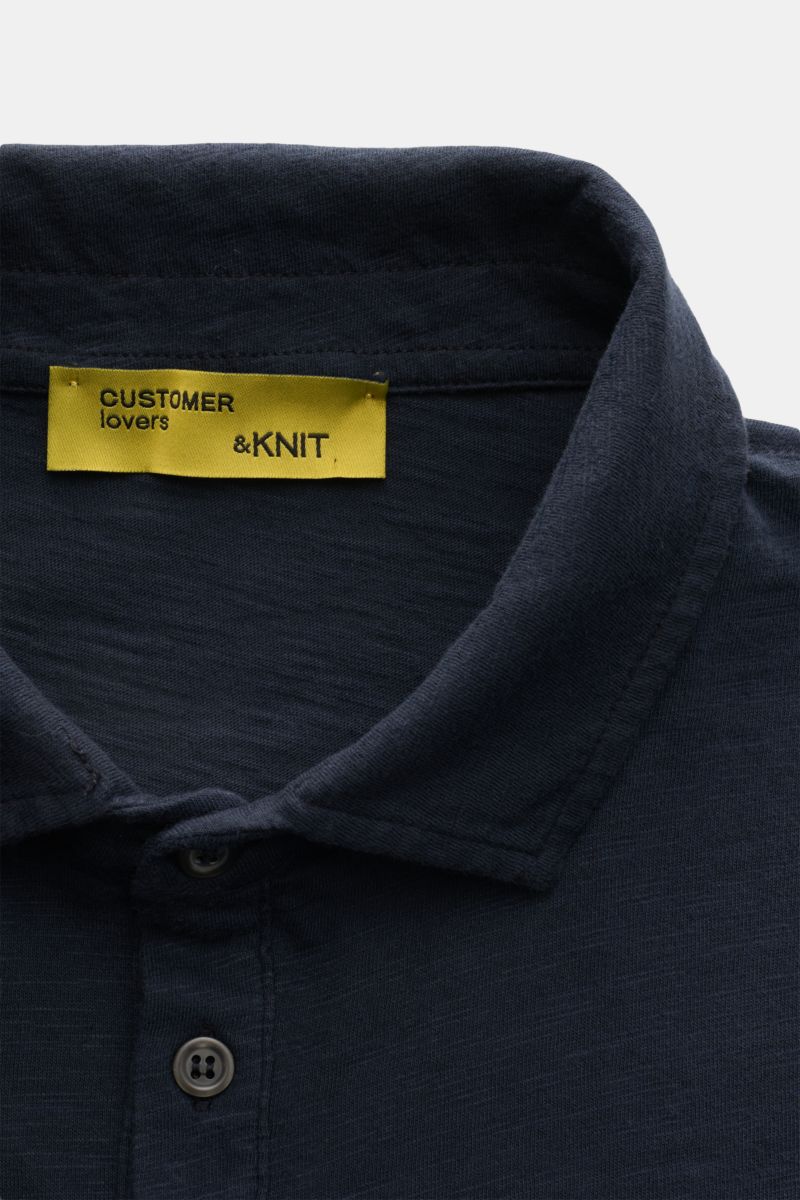 Close-up front view of the B.F. Knitwear Jersey polo shirt navy, showing classic collar and buttons. Uncomplicated classic: This jersey polo shirt by B.F. KNITWEAR is a versatile basic for the warmer months. Pure cotton, soft feel, slim fit, classic polo 