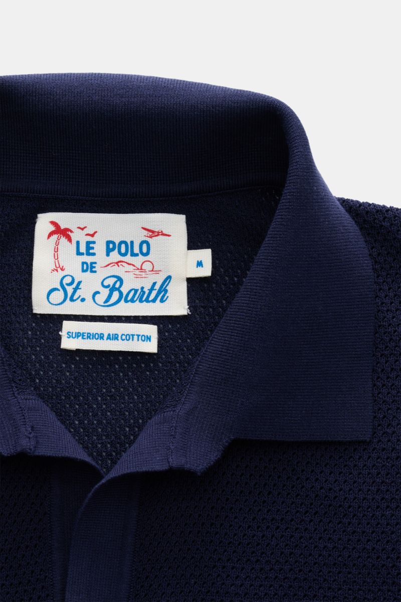 Close-up front view of the navy MC2 Saint Barth Short sleeve knit polo 'Sloan' showing the collar and label with fine textured pure cotton knit.

Light and summery: This knit polo shirt by 