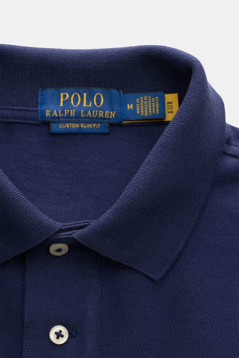 Close-up front view of the Polo Ralph Lauren Polo shirt navy, showing the collar, two-button placket, and fabric texture. The classic among polo shirts since 1972: The iconic pure cotton piqué model with the famous polo rider stitching on the chest wil