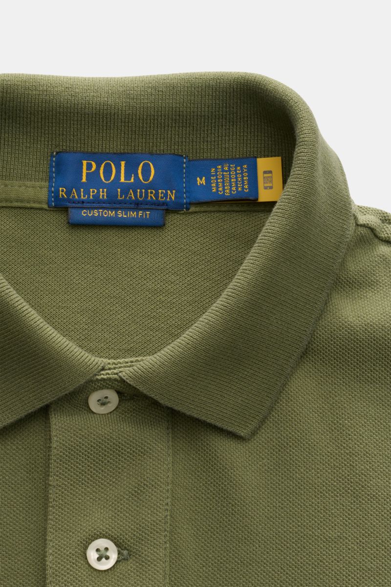 Polo Ralph Lauren Polo shirt olive shown from a close-up front perspective, featuring a classic pure cotton piqué fabric, slim fit, signature collar, two-button placket, elasticated cuffs, hem with side vents, and iconic polo rider stitching on the chest.
