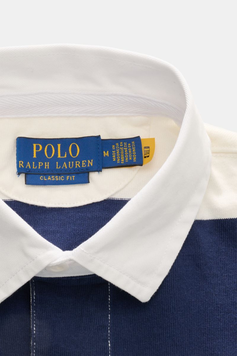 Polo Ralph Lauren Polo shirt navy/off-white striped shown from a close-up top view of the collar and label. The absolute classic among polo shirts since 1972: The iconic pure cotton polo shirt with the legendary polo rider stitching on the chest will a