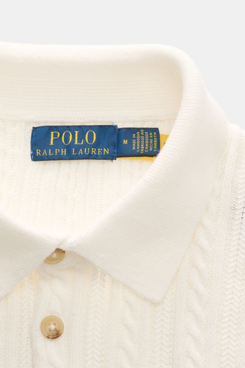 Close-up front view of Polo Ralph Lauren Short sleeve knit polo shirt off-white showing collar, buttons, and fine cable knit pattern.

Versatile classic: This short-sleeved knit polo by POLO RALPH LAUREN delivers maximum comfort and catches the eye on 