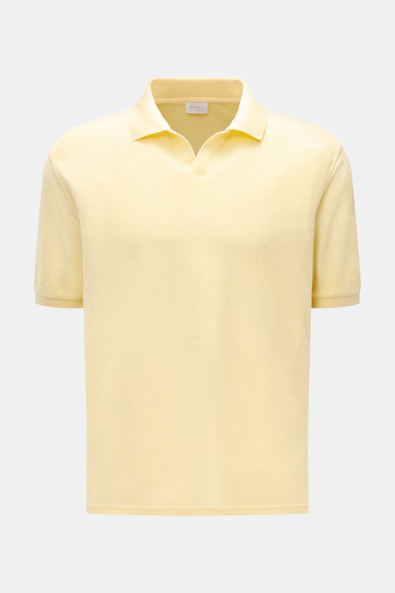 Front view of 04651/ A trip in a bag Terry polo shirt 'Terry Johnny' pastel yellow, a short sleeve cotton terry polo with open collar strip, signature collar, regular fit, soft feel, small woven label in side seam, and short hem vents. Holiday feel you ca