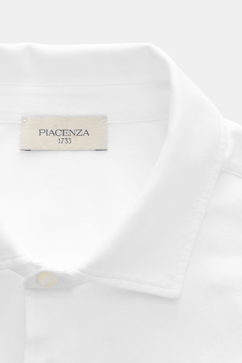 Close-up top-down view of the Piacenza 1733 Jersey shirt slim collar white showing the label inside the narrow collar. Luxurious comfort for everyday wear: This jersey shirt from PIACENZA 1733, made from soft cotton, combines stylish design with exception