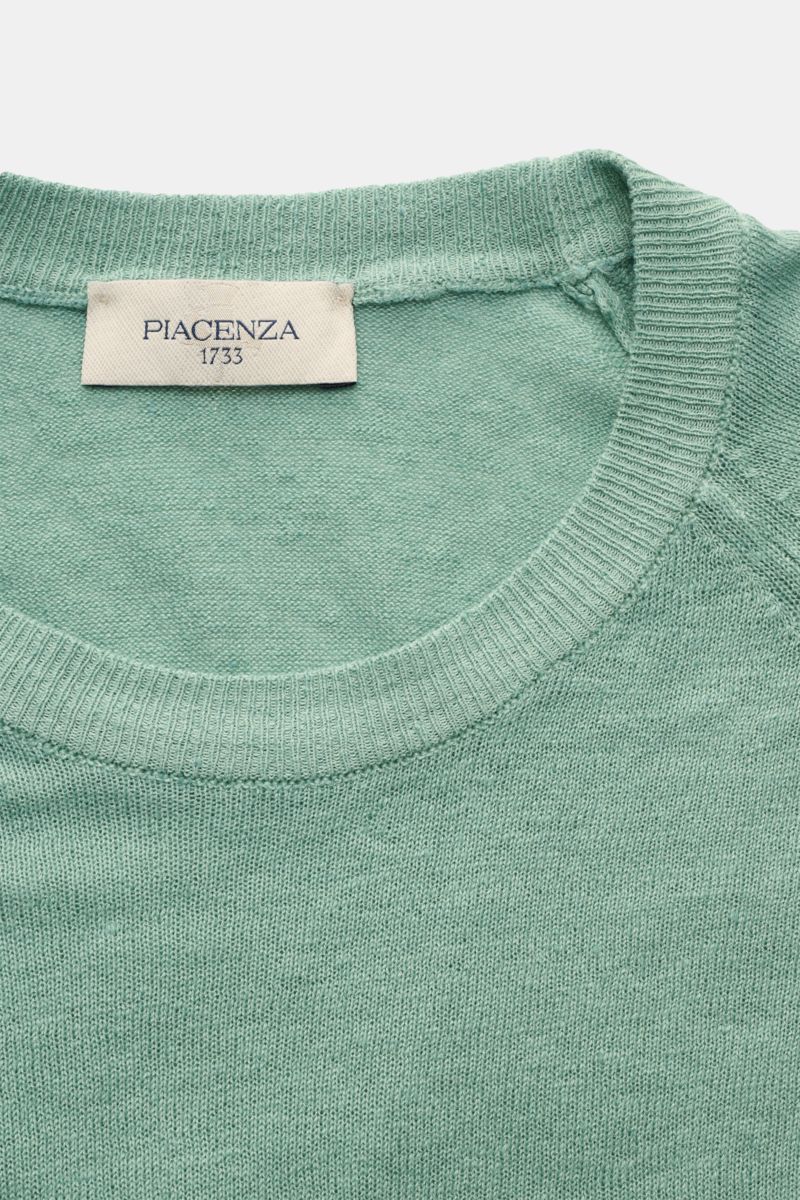 Close-up front view of Piacenza 1733 Short sleeve jumper light green showing crew neck, fine linen-cotton knit, and brand label.

Tradition, innovation and uncompromising quality: For centuries, PIACENZA 1733 has been synonymous with Italian craftsmans