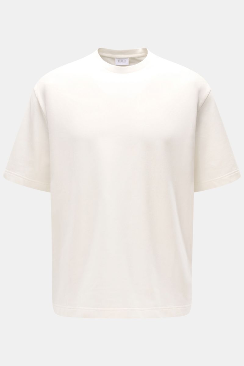 Front view of the 04651/ A trip in a bag Crew neck T-shirt 'If Tee' cream, an oversized, heavy fabric cotton jersey tee with a crew neck and side seam woven label.  

The uncomplicated cotton T-shirt 'IF Tee' by 04651/ A TRIP IN A BAG is a core basic f