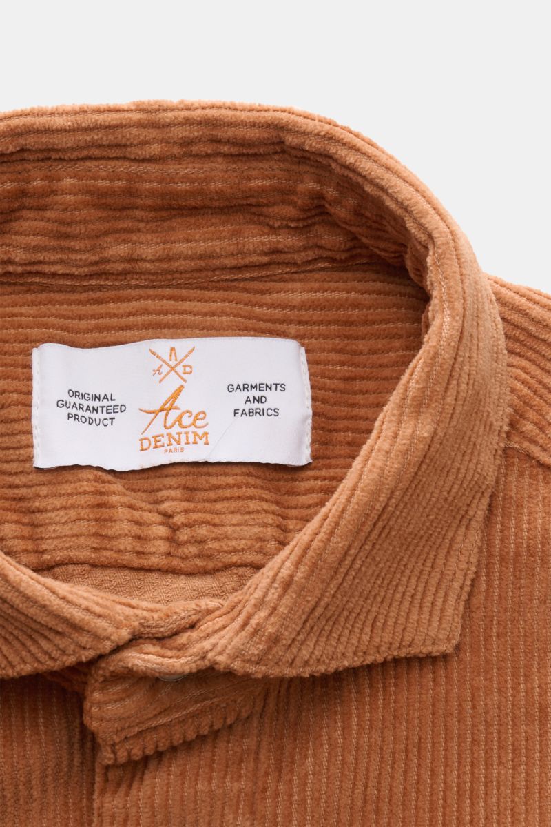 Close-up front view of the Ace Denim Corduroy overshirt light brown collar showing soft pure cotton fabric and brand label inside collar.
