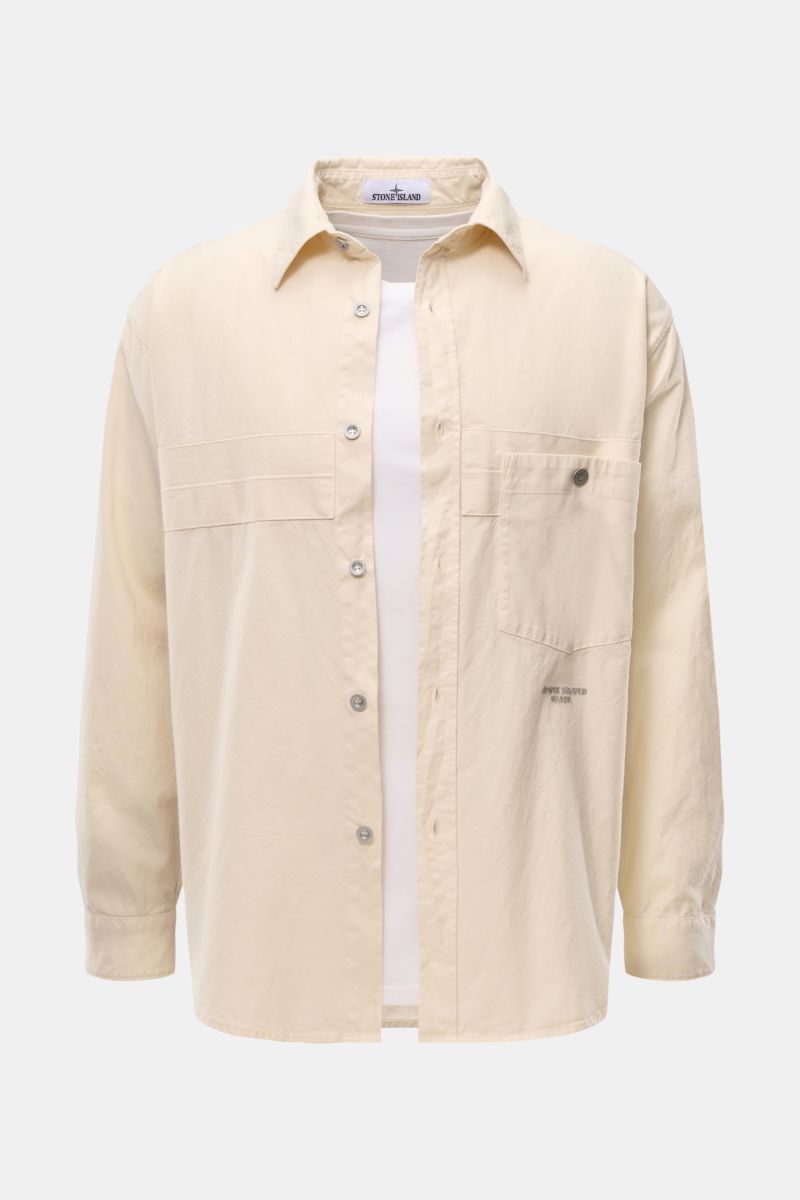 Front view of Stone Island Overshirt 'Marina' creme in lightweight pure cotton Panama weave, regular fit with six-button placket, spread collar, chest pocket with button, MARINA stitching on front, and cuffed sleeves, ideal for urban transitional layering