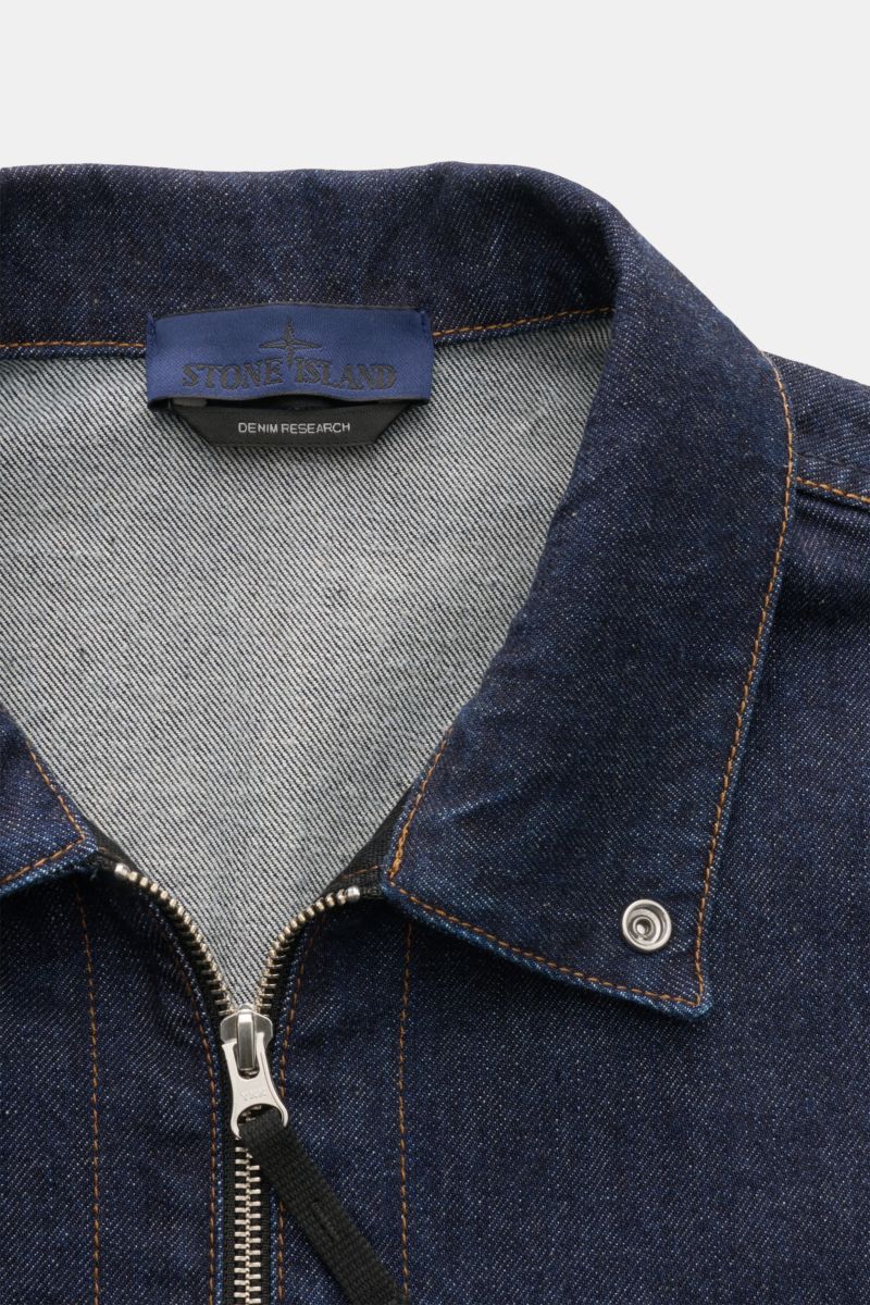 Close-up front view of Stone Island Denim overshirt navy showing indigo-dyed cotton fabric, turn-down collar, two-way zip, and detailed stitching. For casual denim looks: Made from indigo-dyed cotton yarn, this overshirt from the STONE ISLAND 'Denim' Caps
