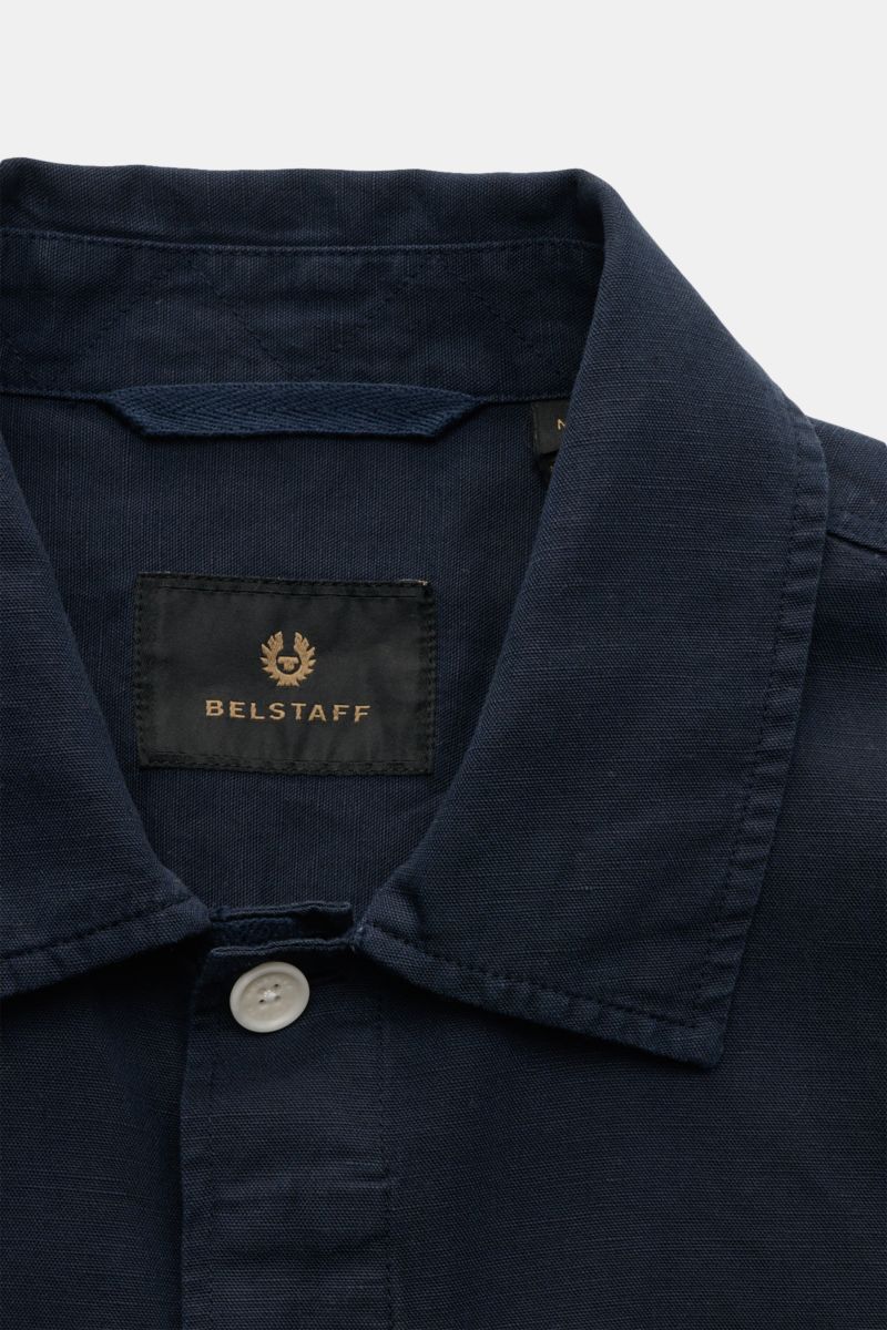 Belstaff Overshirt 'Maritime' navy close-up from above, showing narrow collar, single white button, and black BELSTAFF label inside collar.