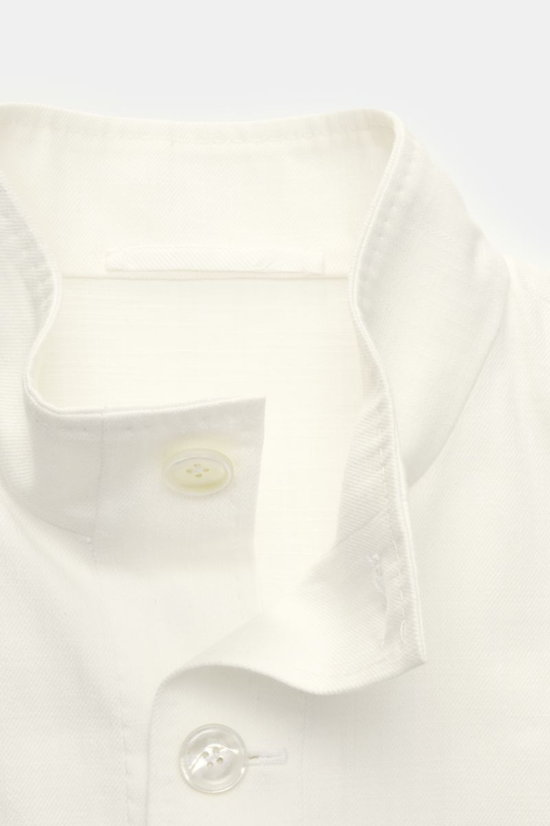 Close-up front view of the Stile Latino Overshirt 'Gbu Teseo' cream showing the standing collar, seven-button placket, and smooth cotton fabric. Luxurious layers: This sophisticated overshirt by STILE LATINO combines exquisite quality with timeless elegan