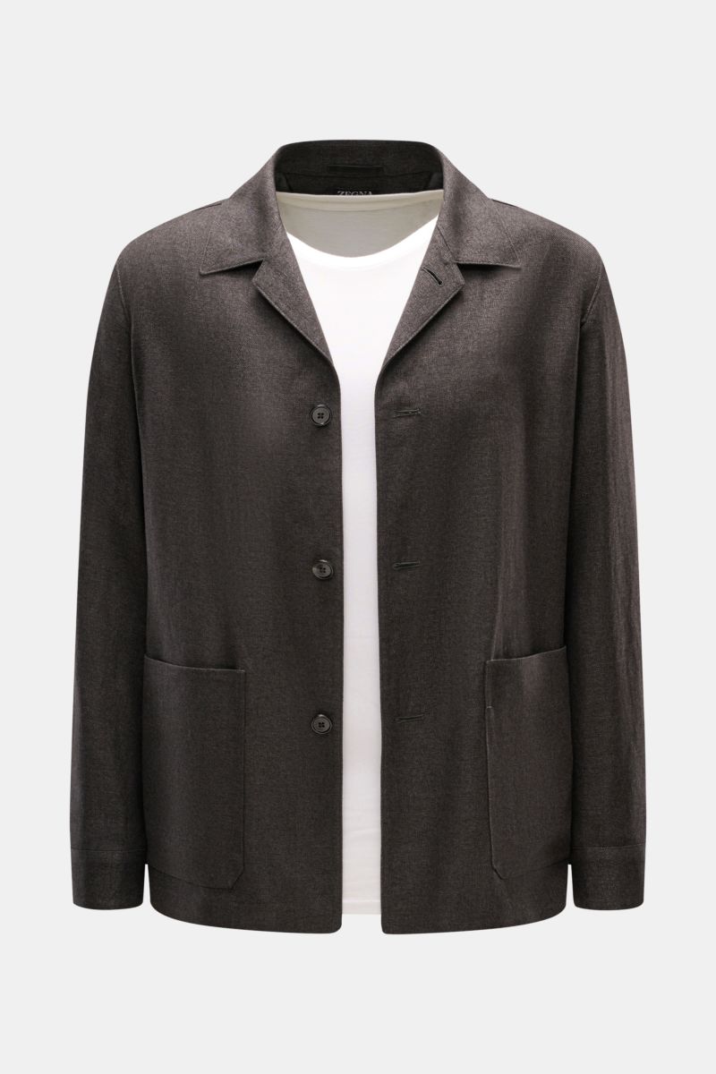 Front view of Zegna Overshirt grey-brown melange in linen and wool blend with lapel collar, three-button placket, and patch hip pockets.

This overshirt by ZEGNA, made from linen and wool, embodies Italian casual style with its pleasantly soft feel and