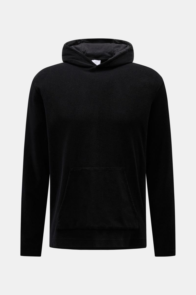 Front view of 04651/ A trip in a bag Terry hooded jumper 'Terry' black made of soft pure cotton terrycloth with hood and kangaroo pocket.

Description: Comfort and coolness with summery nonchalance: The hooded jumper 'Terry' by 04651/ A TRIP IN A BAG m