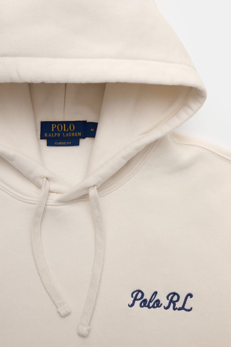 Close-up front view of Polo Ralph Lauren Hooded jumper white showing drawstring hood, navy 'Polo RL' embroidery on chest, and soft fleece inside.

Iconic signature style by POLO RALPH LAUREN: This hooded jumper with a soft fleece lining combines casual
