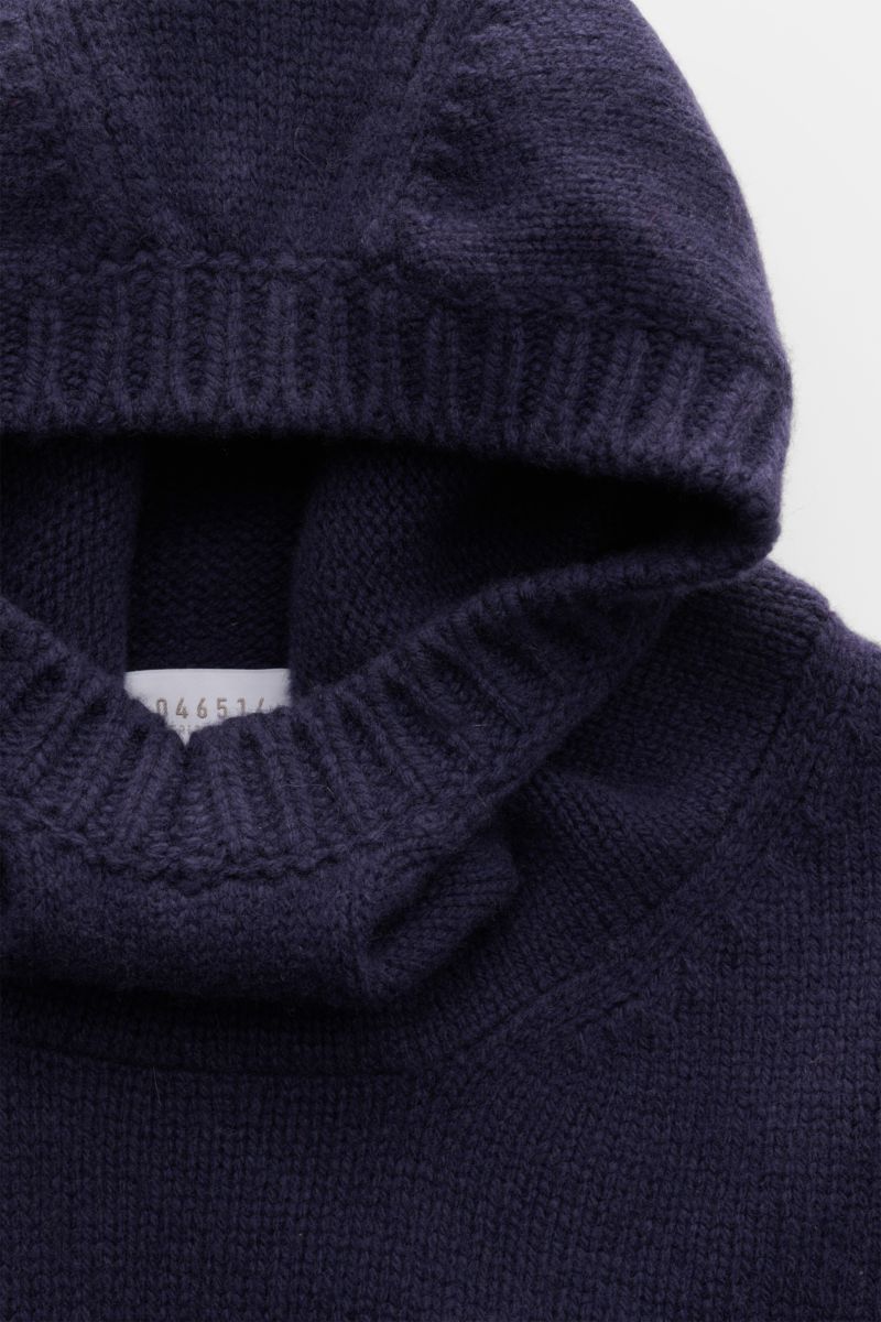 Close-up front view of the hood and high shawl collar of the 04651/ A trip in a bag Hooded jumper dark blue, showcasing its medium-fine knit texture and wide ribbed bands. Provides reliable warmth: This hooded jumper from 04651/ A TRIP IN A BAG, with i