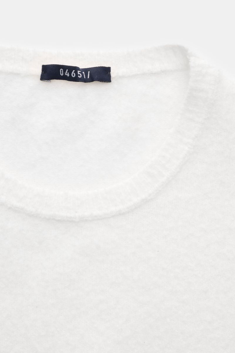 04651/ A trip in a bag Crew neck jumper 'Cocoon Crew' white shown from a top close-up view, featuring soft bouclé texture, elasticated cotton-microfibre blend, slim fit, fine knit, and flexible ribbed bands for a comfortable feel. The crew neck jumper 