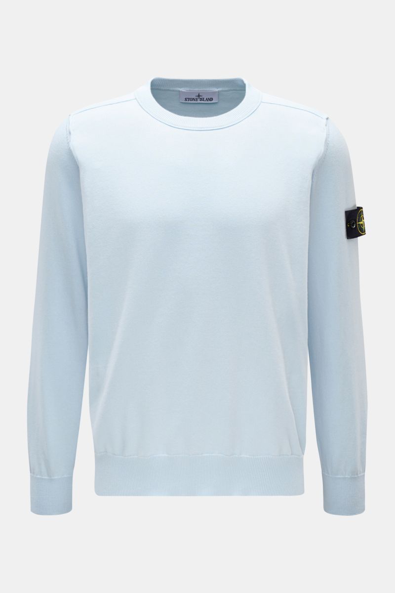 Front view of Stone Island Crew neck jumper pastel blue, knit from pure cotton with a soft feel, fine knit, slim fit, outer seams, elasticated ribbed bands, and signature compass badge on the upper sleeve. 

Timeless classic: This knitted jumper by STO