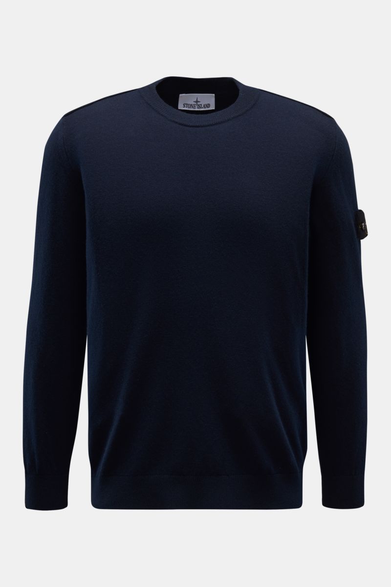 Front view of Stone Island Crew neck jumper navy in pure wool, featuring a soft, fine knit, regular fit, crew neck, tonal compass badge on upper sleeve, and elasticated ribbed bands. 

A timeless piece from STONE ISLAND: If you want to create a warm, s