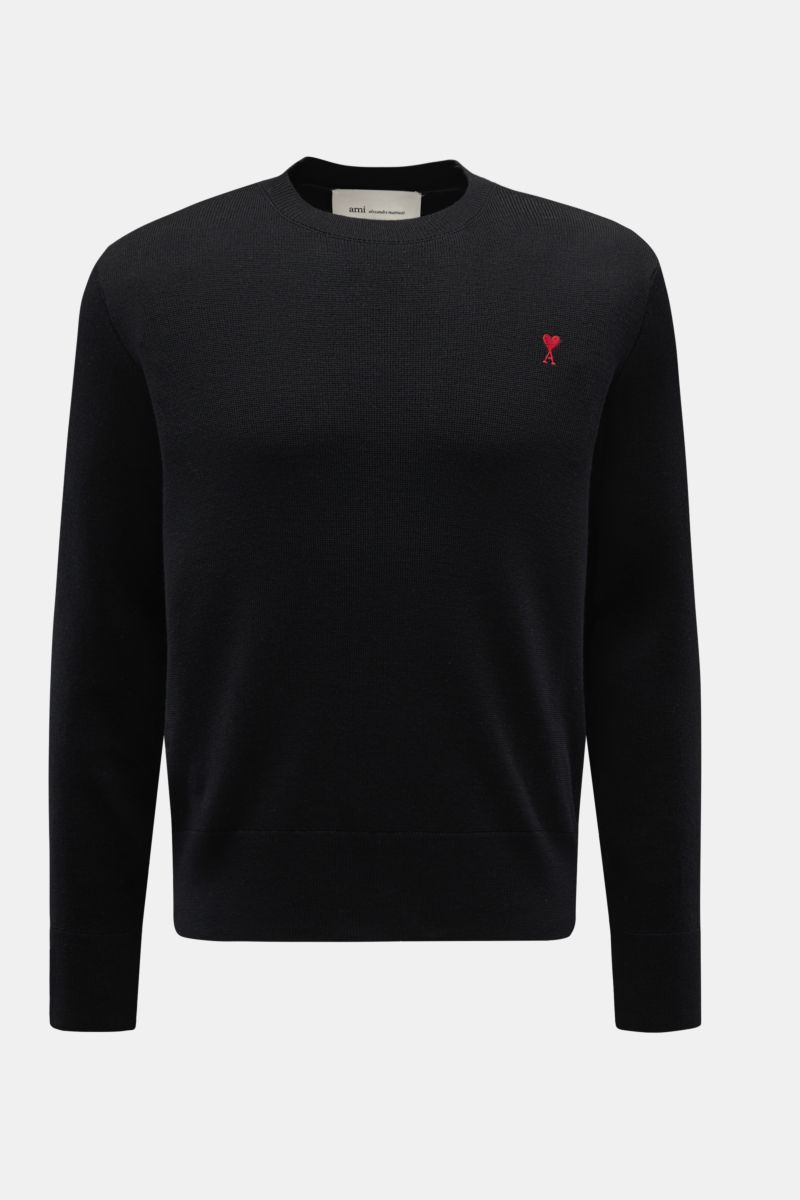 A front view of the Ami Paris Merino crew neck jumper black, made from pure merino wool with soft feel, fine knit, regular fit, crew neck, logo stitching on chest, and ribbed bands. 

Timeless basic: The AMI PARIS crew neck jumper made from pure merino