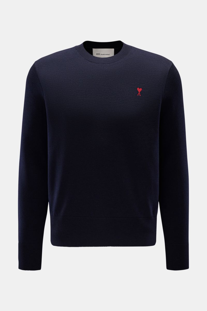 Front view of Ami Paris Merino Rundhalspullover navy, a timeless basic crew neck sweater made of pure merino wool with soft touch, fine knit texture, regular fit, logo stitching on chest, and comfortable ribbed cuffs.

Zeitloses Basic: Der AMI PARIS Ru