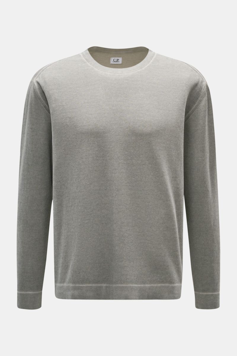 Front view of C.P. Company Crew neck jumper grey in pure cotton with a soft feel, fine knit, regular fit, ribbed bands, and logo print on sleeve hem. 

Description: With its distinctive garment-dyed design, this crew neck jumper in pure cotton by C.P. 