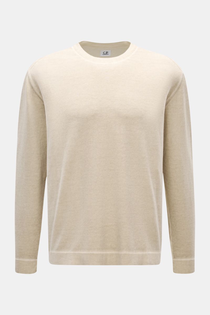 Front view of C.P. Company Crew neck jumper beige in pure cotton with a soft feel, garment-dyed design, fine knit, regular fit, ribbed bands, and logo print on sleeve hem.

With its distinctive garment-dyed design, this crew neck jumper in pure cotton 