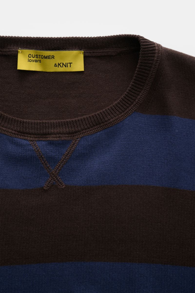Close-up front view of B.F. Knitwear Crew neck jumper navy/dark brown striped with fine knit, quilted stitching, and elasticated rib bands.

Description: Lightweight summer knit by experts B.F. KNITWEAR: This fine knit crew neck jumper in cotton with bloc