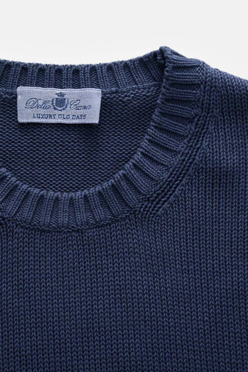 Close-up top-front view of the Della Ciana Crew neck jumper dark blue showing the ribbed crew neck and fine knit texture.

This elegant Italian cotton jumper by DELLA CIANA will enhance your spring wardrobe with its classic fit and can be styled in a v