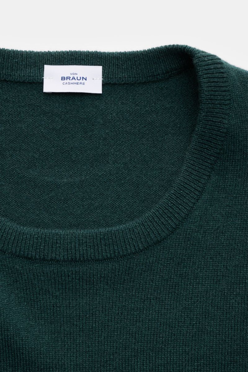 von Braun Cashmere crew neck jumper dark green shown from above, highlighting fine knit, slim fit, soft pure cashmere, crew neck, and ribbed bands; a versatile essential for colder months adding timeless elegance.